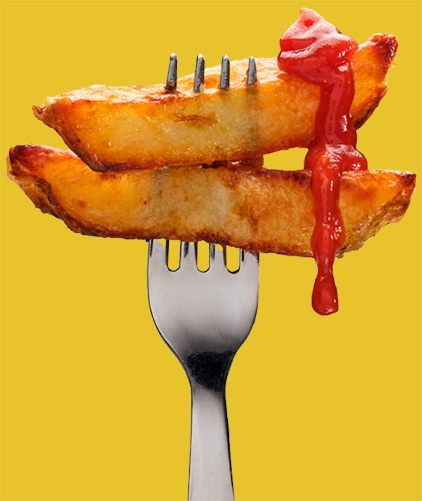 Fork with chips and ketchup.